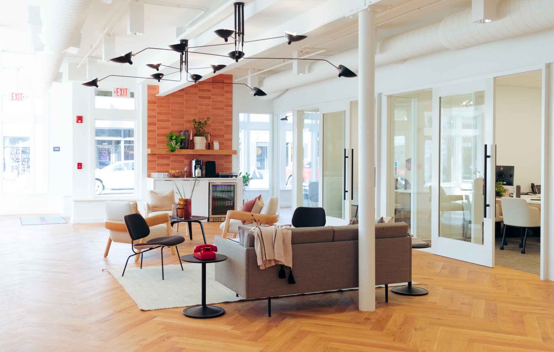 A bank lobby with midcentury modern furniture.